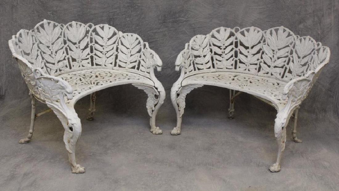 (2) Cast Aluminum Griffin Decorated Garden Settees: Open fretwork seat and back with winged griffin and paw feet, 31"h x 42"w x 15"d.