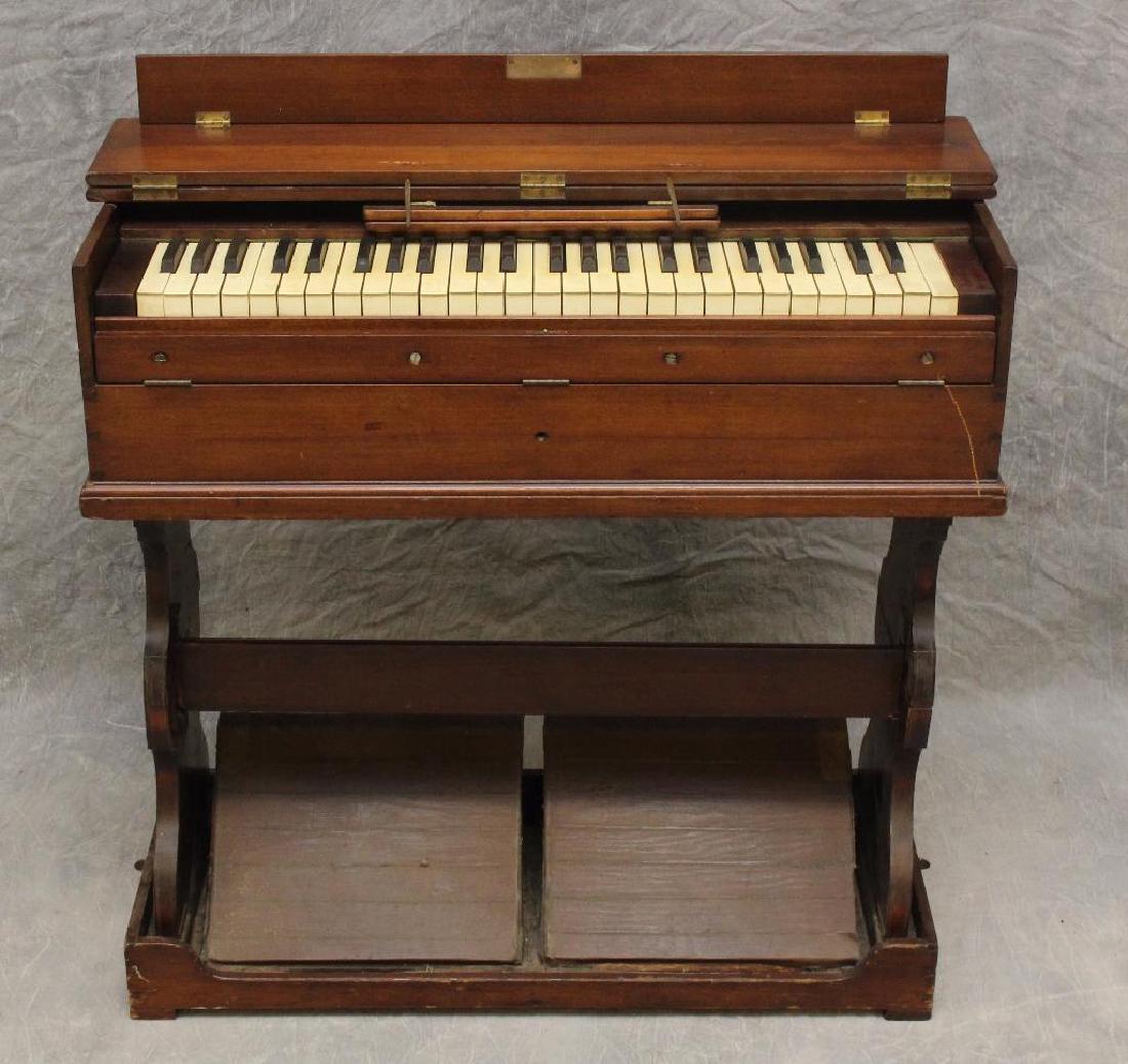 Traveling Musician's Pump Organ: Portable fold down organ with sheet music stand, 35"h x 30"w x 13"d.