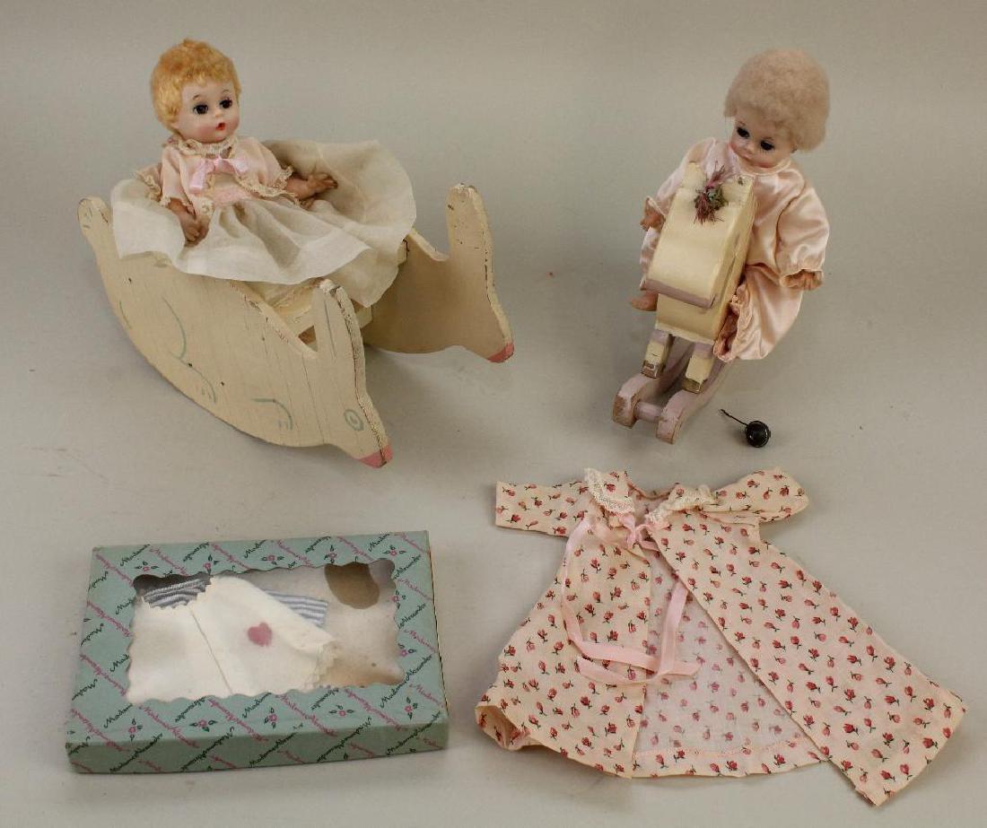PAIR OF 8" 1956-1962 HP/VINYL MADAME ALEXANDER "LITTLE: (1) Doll is dressed in tagged outfit. She is sitting on a rabbit glider. (2) Doll has (2) pieces of unmarked clothing. She is sitting on a wooden rocking horse. Also comes with unmarked 2 pc. outfit i