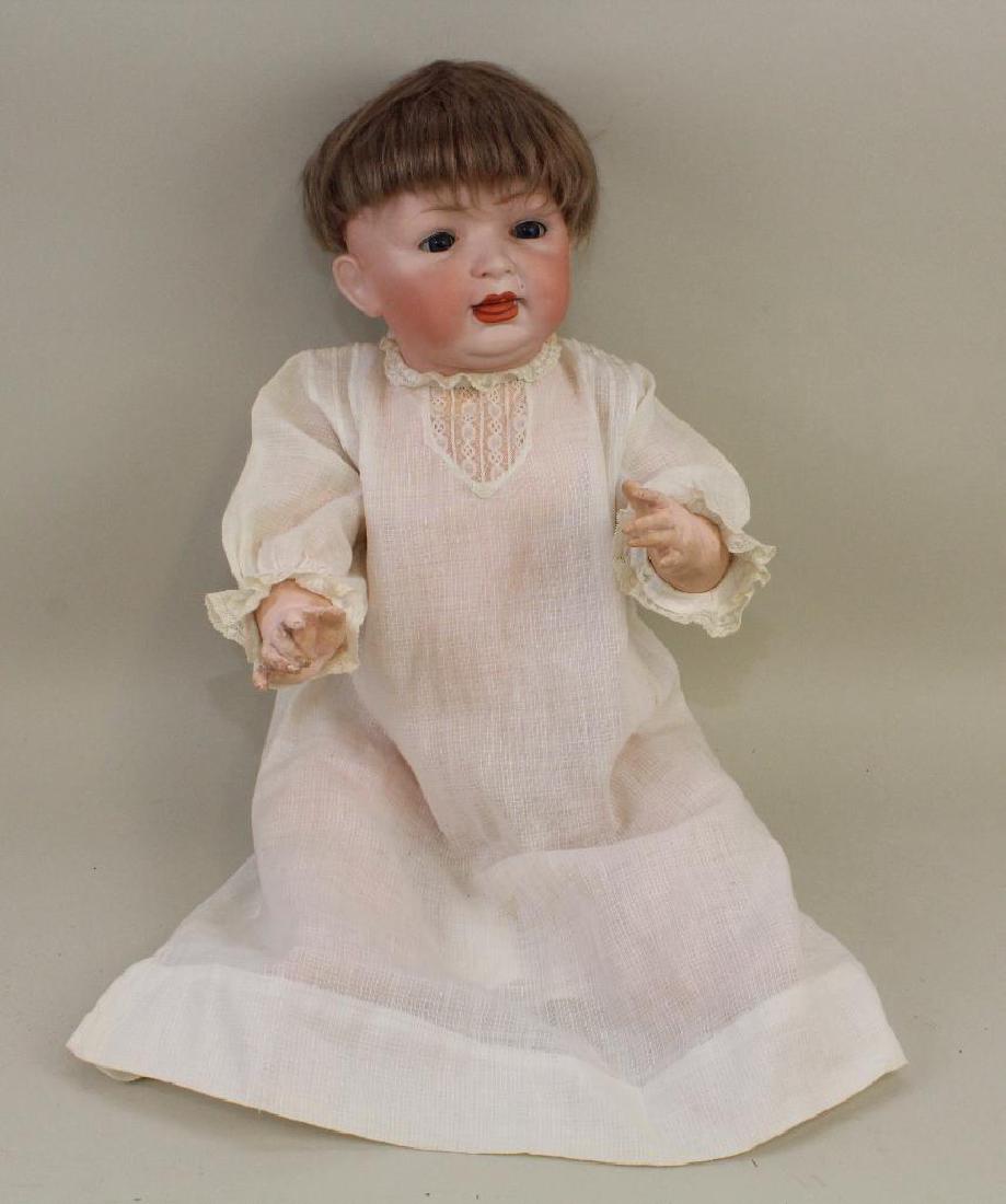 25" ANTIQUE BISQUE HEAD 152 14 CHARACTER BABY.: Blue sleep eyes, open/closed mouth, tosca mohair wig. 5 Pc. papier mache bent limb baby body. Dressed in antique baby dress. Condition: nothing observed on bisque after careful examination. Spot of ho