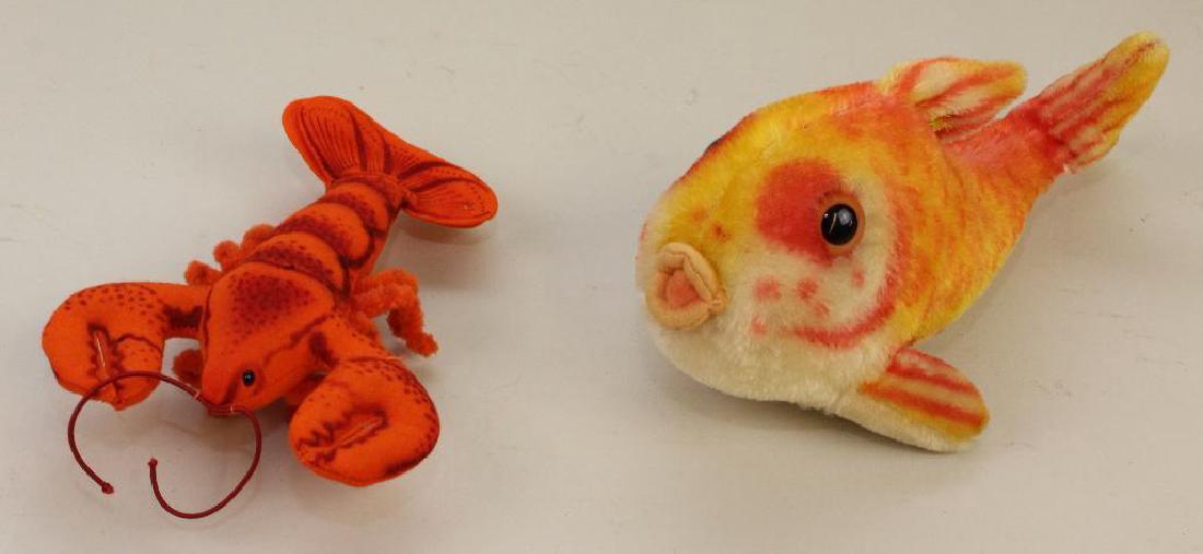 PAIR OF TAGGED STEIFF ITEMS: FELT "CRABBY" LOBSTER &: 7" L Orange felt lobster. Raised silver button. 11" L Varigated (orange/yellow) mohair fish with felt mouth. Incised silver button. Condition: nothing observed.