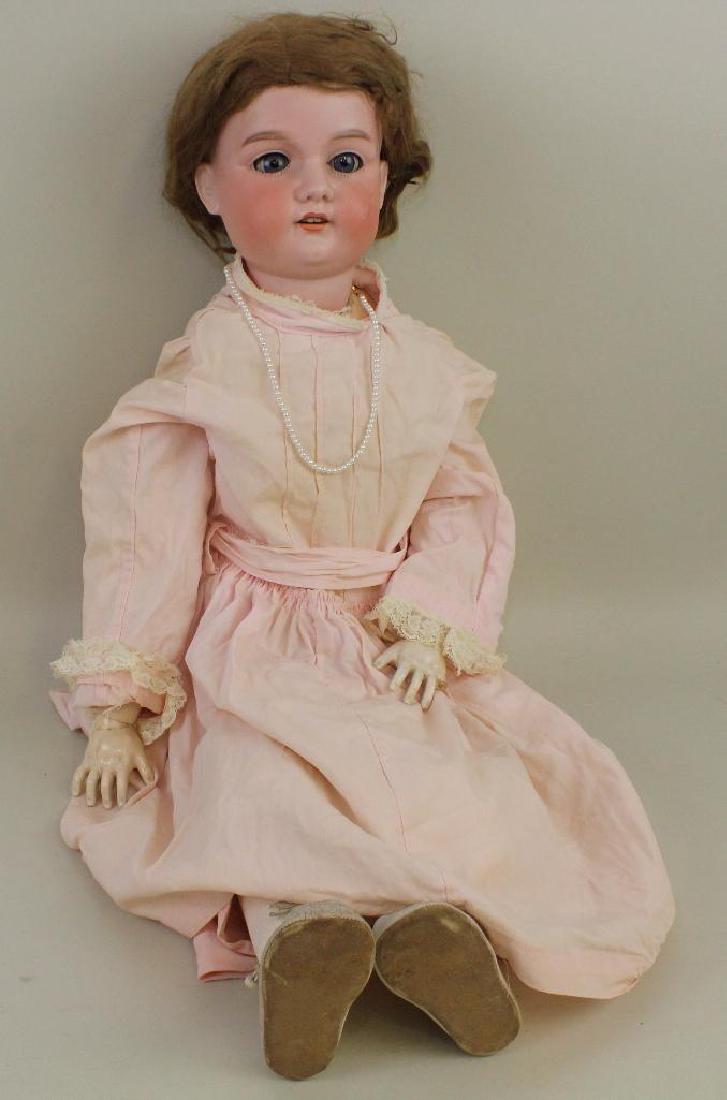 BODY PARTS & SUPPLIES: 31" A.14.M. ANTIQUE BISQUE HEAD: Blue sleep eyes, open mouth, brown mohair wig. Papier mache ball jointed body. Dressed in vintage children' clothing. Condition: head is damaged. Body has been repainted. This lot is being sold AS IS.
