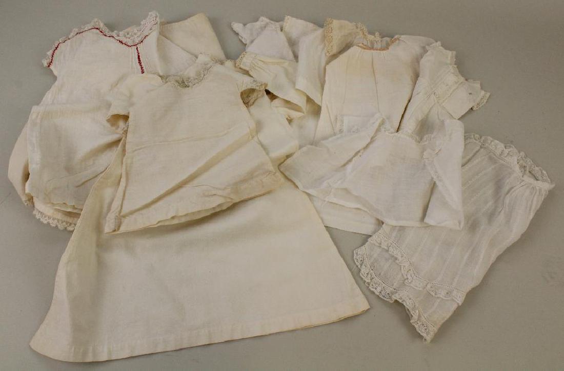 BODY PARTS & SUPPLIES: LOT OF ANTIQUE DOLL NIGHTGOWNS,: (11) Pcs. of white cotton bodices, nightgowns, tops. Various sizes. Condition: minor age discoloration.