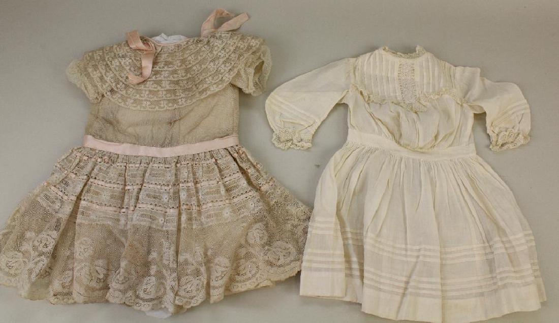 BODY PARTS & SUPPLIES:  LOT OF ANTIQUE DOLL DRESSES. (1 of 1)