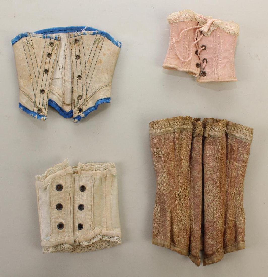 BODY PARTS & SUPPLIES: LOT OF ANTIQUE DOLL CORSETS. (1 of 2)
