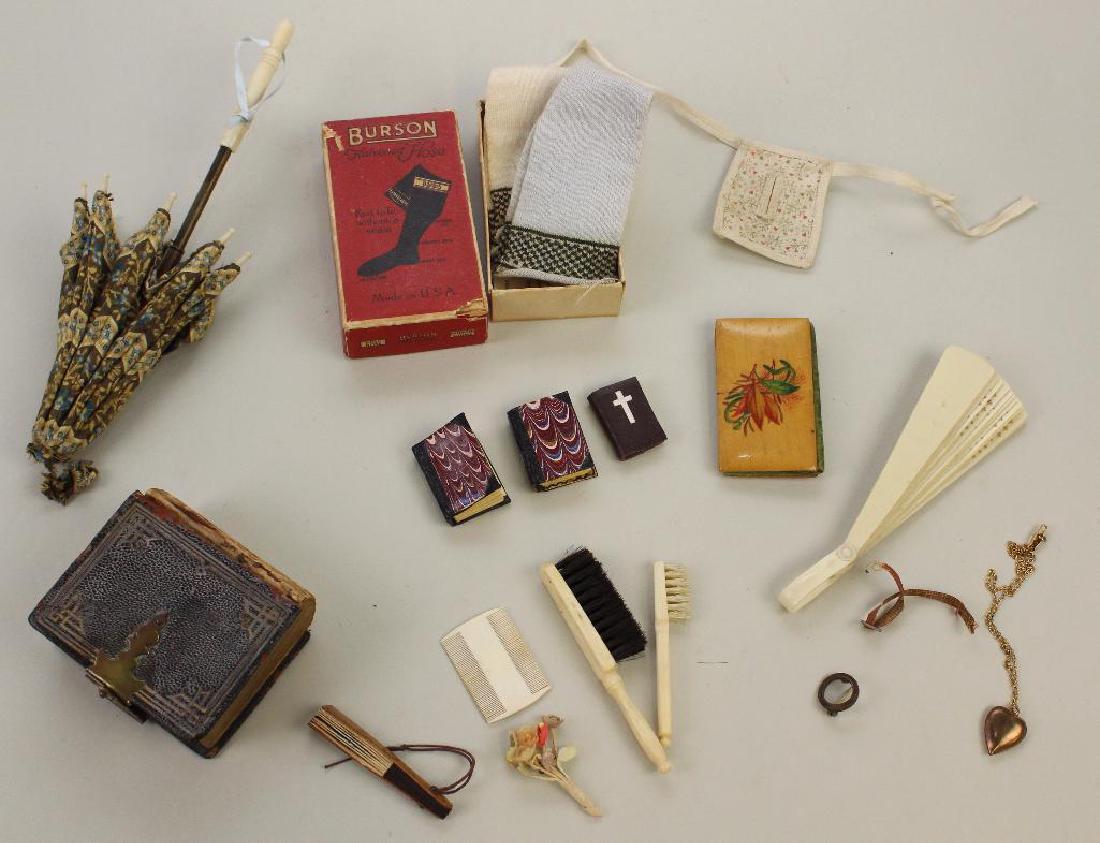 LOT OF ANTIQUE DOLL ACCESSORIES.: 7" Parasol with printed cotton cover, bone handle over brass shaft (damage to bone). (2) Prs. cotton BURSON Fashion Hose in original box. Painted celluloid and mini paper fans. Needle case. (3) Mini b