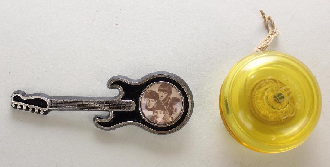 4" BLACK PLASTIC BEATLES GUITAR PIN. (1 of 3)