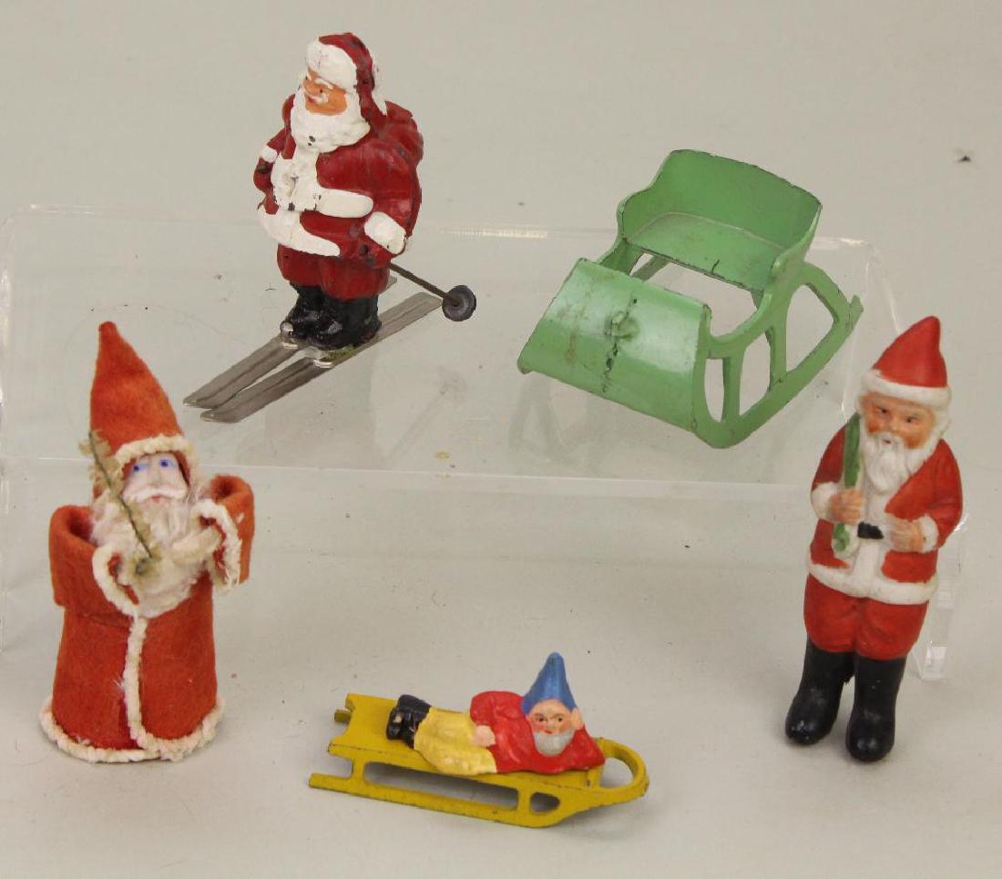 LOT OF CHRISTMAS: SANTAS.: Painted all bisque, Japan. Felt Santa with papier mache face. Metal Santa on skiis. Also - Elf, metal sleigh and sled.