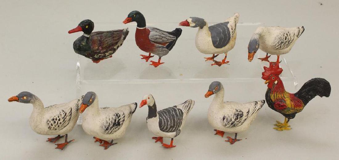 LOT OF PAPIER MACHE & METAL BIRDS.: (1) Metal duck (paint loss). (7) Papier mache ducks with metal feet. (1) Papier mache rooster with metal feet. Condition: as stated.