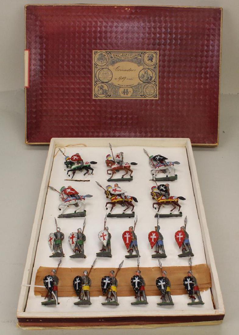 BOX OF GERMAN "CRUSADORS" No.919.: Box end reads: Lead Soldiers. (6) Crusadors on horseback, (12) Crusadors on foot. These are all sewn into the original box. FAO Schwarz label on bottom of box. Condition: (1) mounted Crusador is missi