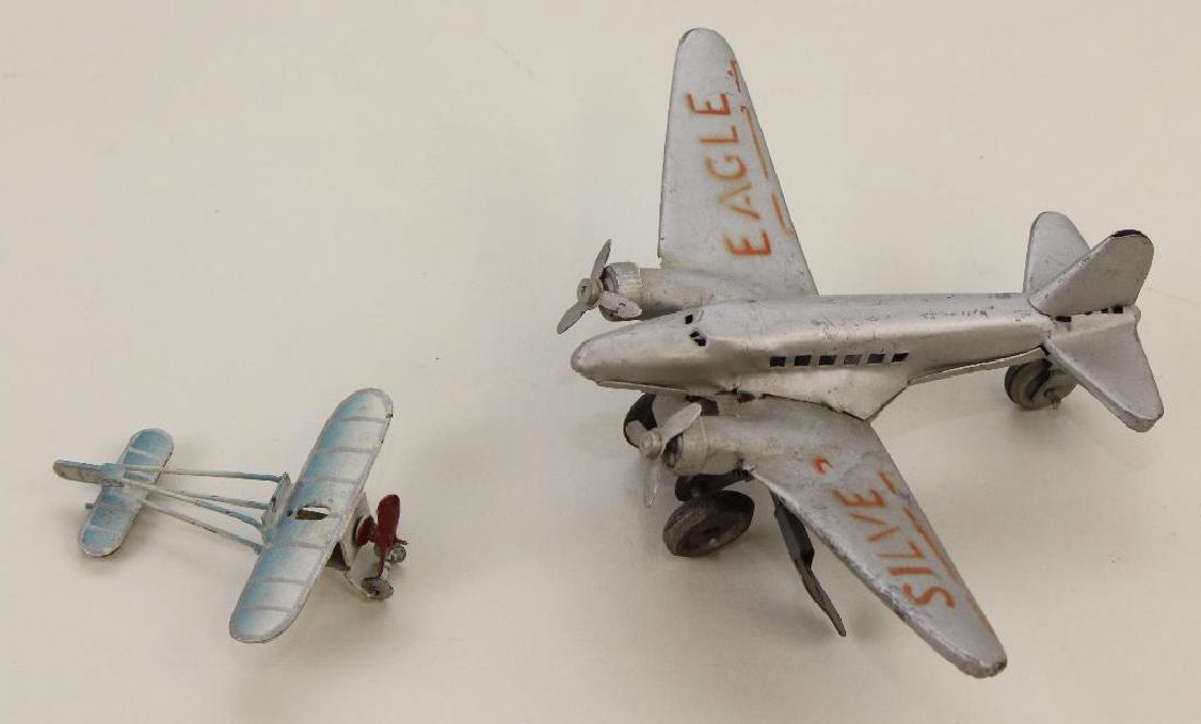 PAIR OF METAL AIRPLANES. (1 of 4)