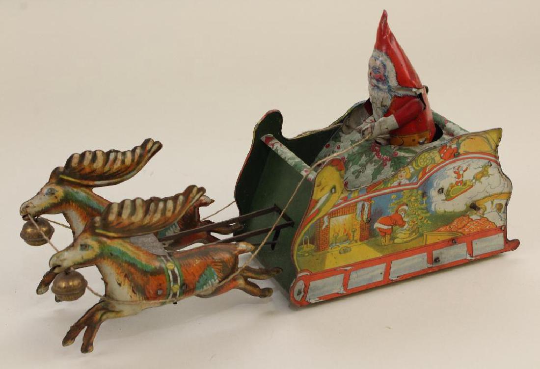 11 1/2"  STRAUSS TIN LITHO "SANTEE CLAUS" WINDUP TOY. (1 of 4)