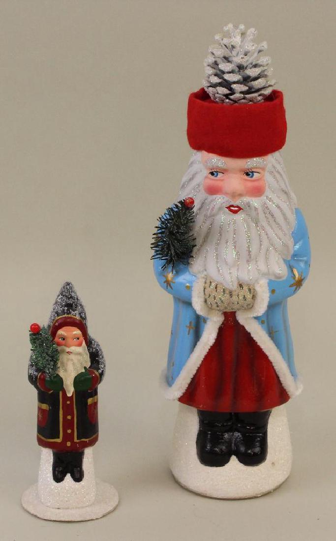 PAIR OF CHRISTOPHER RADKO PAPIER MACHE CHRISTMAS CANDY: 6" 1995 Belschnickle #30/600, Made in Germany. 12 1/2" 1993 Belschnickle #56/600, Made in Germany. Both open from the bottom.