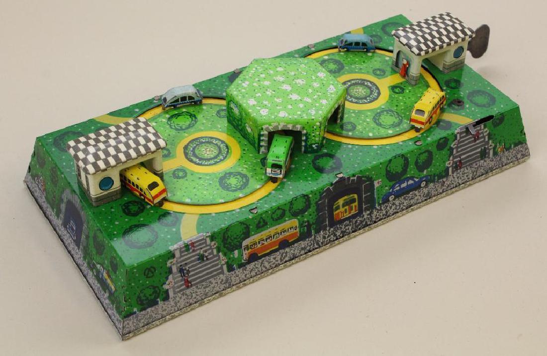 9 1/2" UNMARKED "BUS DEPOT" TIN WINDUP TOY. (1 of 2)