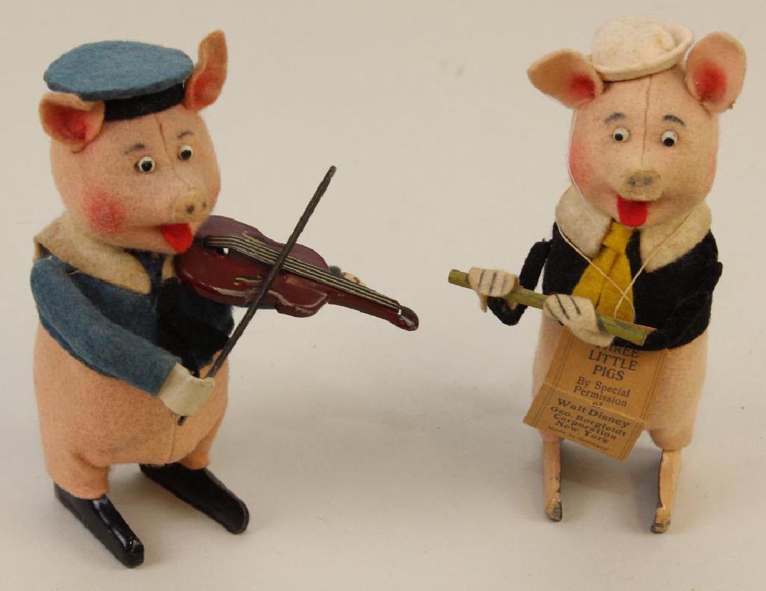 PAIR OF 4 1/2" SCHUCO "THREE LITTLE PIG" WINDUP TOYS. (1 of 4)