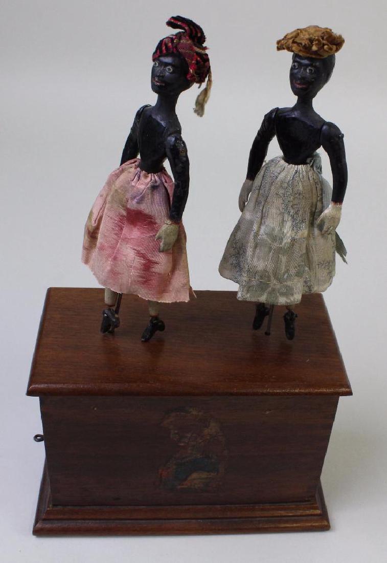 PAIR OF BLACK DANCERS ON PLATFORM TOY. (1 of 4)