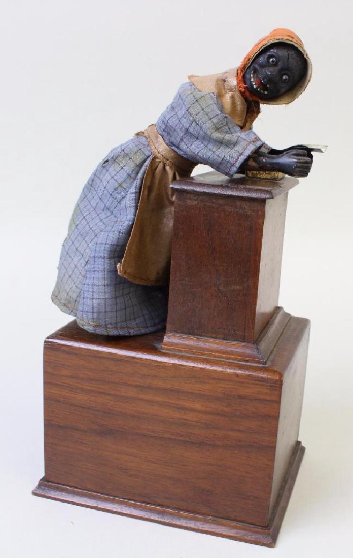 9 1/2" BLACK FEMALE ABOLITIONIST ON PLATFORM TOY. (1 of 4)