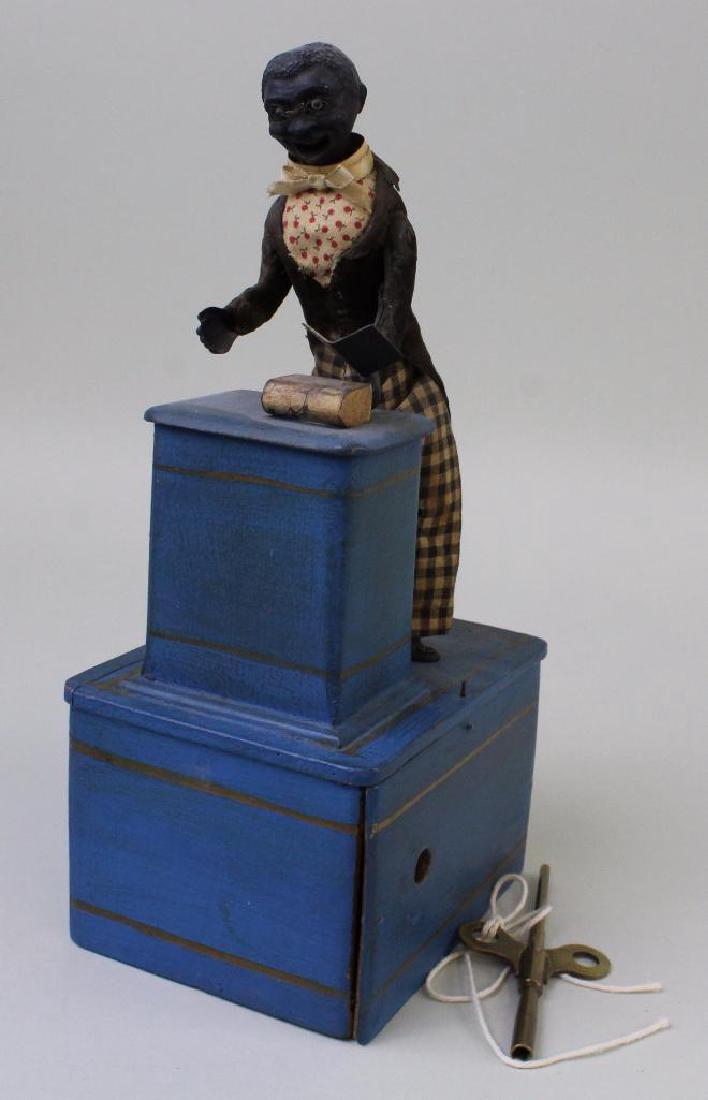 10 1/2" BLACK MALE ABOLITIONIST ON PLATFORM TOY. (1 of 5)