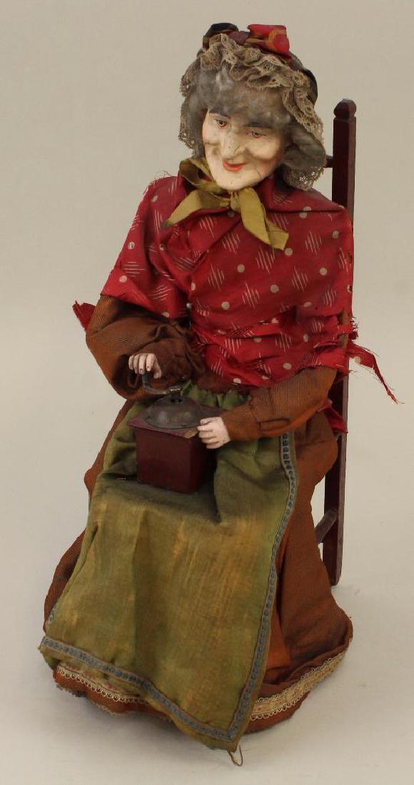 14" SEATED ELDERLY WOMAN PLAYING HER MUSIC BOX. (1 of 5)