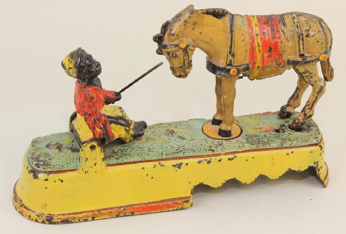 ANTIQUE CAST IRON BANK: "ALWAYS DID 'SPISE A MULE". (1 of 4)