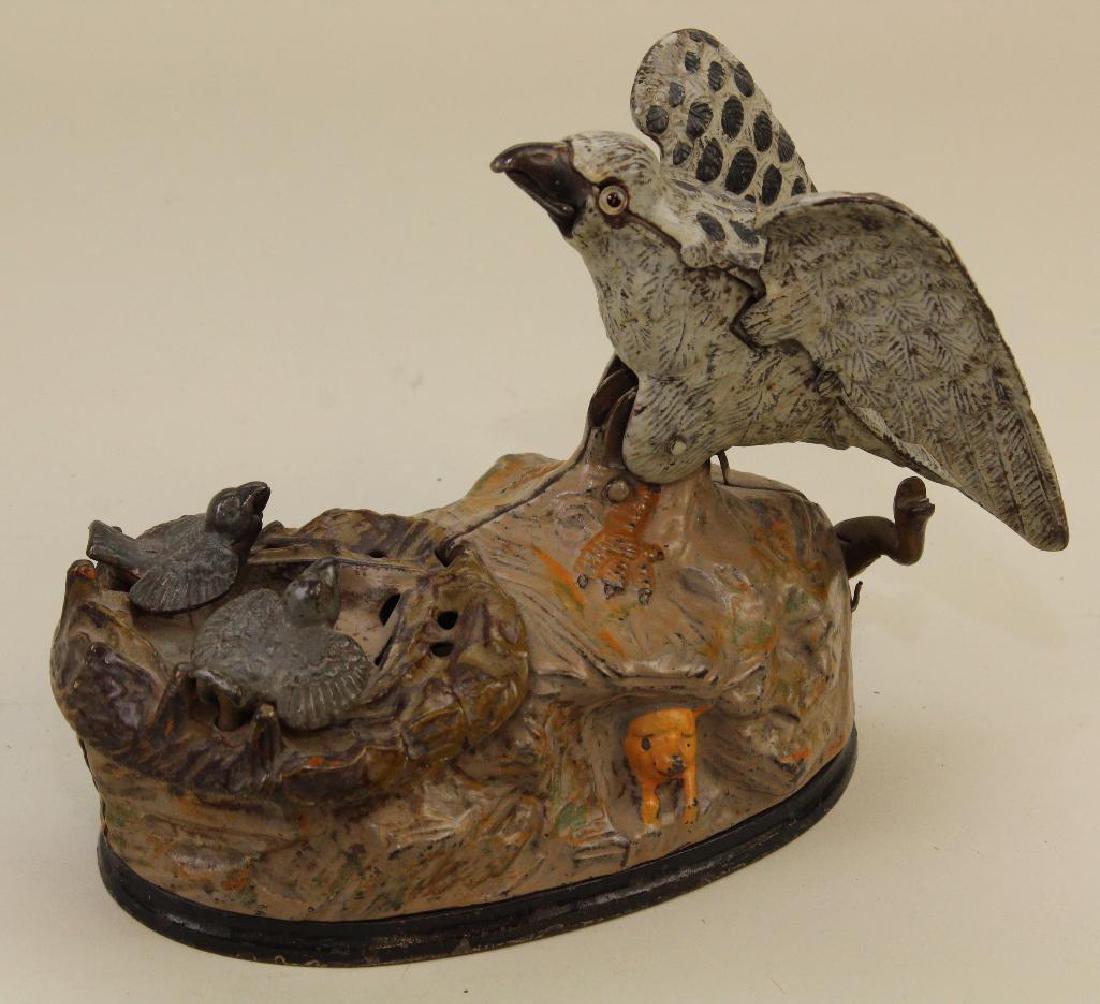 ANTIQUE CAST IRON BANK: "EAGLE AND EAGLETS". (1 of 4)