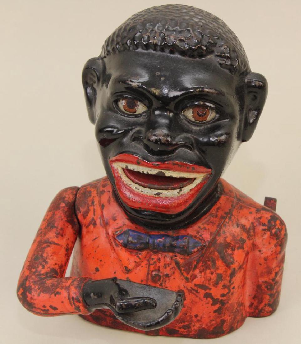 ANTIQUE CAST IRON BANK: "JOLLY N" BUST.: PAT IN CANADA May 27, 1883. Made by SHEPPARD HARDWARE CO., Buffalo, NY. Condition: paint loss, mostly on clothing but also on left eye and on teeth. In good working order.