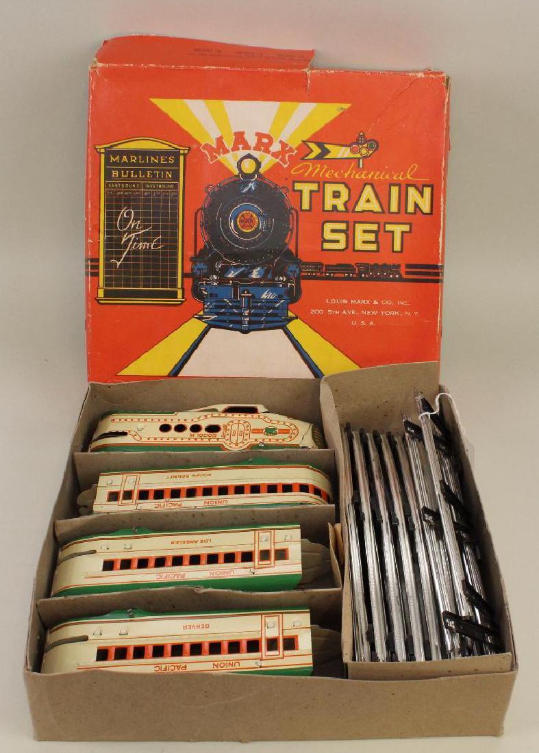No. 773 MARX MECHANICAL STREAMLINE TRAIN SET, ORIGINAL: Includes Union Pacific Locomotive M10005, Squaw Bonnet, Los Angeles, Denver. Track sections. Instruction paper. Envelope for No. 500 Locomotive Key. Key is missing. Condition: this set appears never t