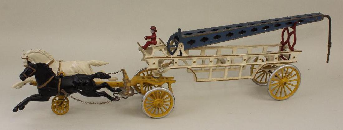 27" CAST IRON HORSE DRAWN AERIAL HOSE TRUCK. (1 of 3)