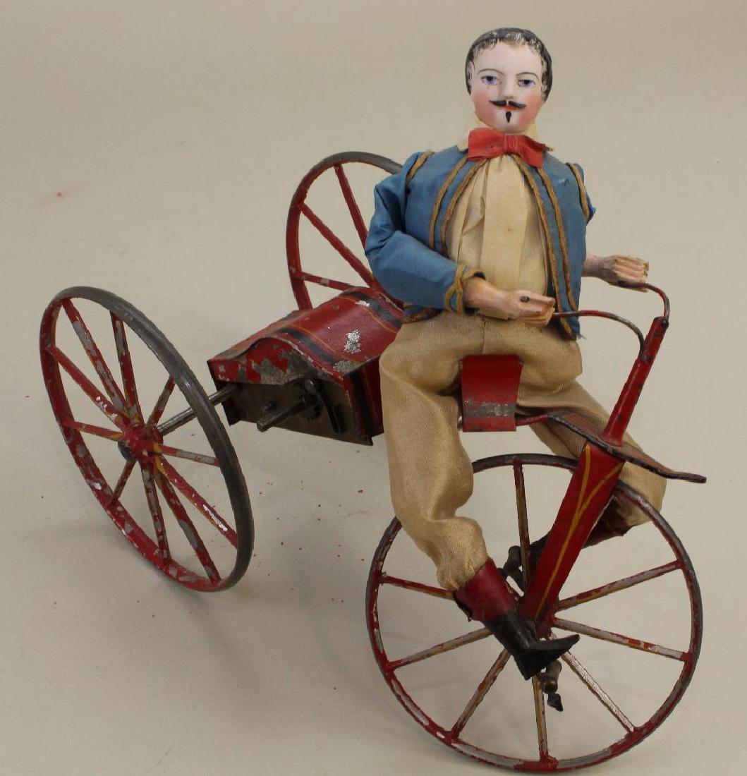BISQUE HEAD MAN RIDING VELOCIPEDE CLOCKWORK TOY. (1 of 5)