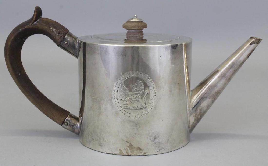 Robert Makepeace & Richard Carter, Sterling Silver Tea: Sterling silver, round can shaped, tea pot with wooden handle and finial. Made by Robert Makepeace & Richard Carter, London, 1777. Hallmarks on underside. Side engraved with oval and illustration 