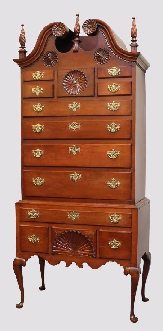 New England Cherrywood Highboy: Marriage piece with a broken arch pediment with twisted reeded finials, shell carved center drawer flanked by four short drawers over four graduated drawers over one over a center fan carved three dra