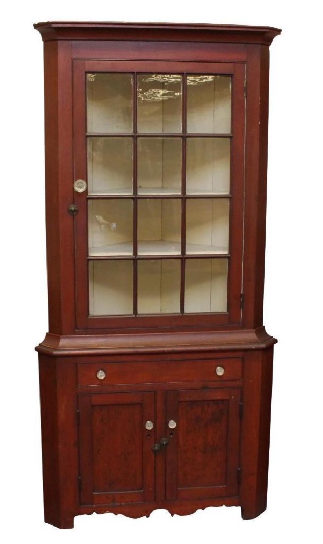 Pennsylvania Federal Red Wash Corner Cupboard: Molded cornice with a twelve lite door over two doors with sandwich glass knobs, on shaped feet and old surface. 88"h x 42"w x 21"d.