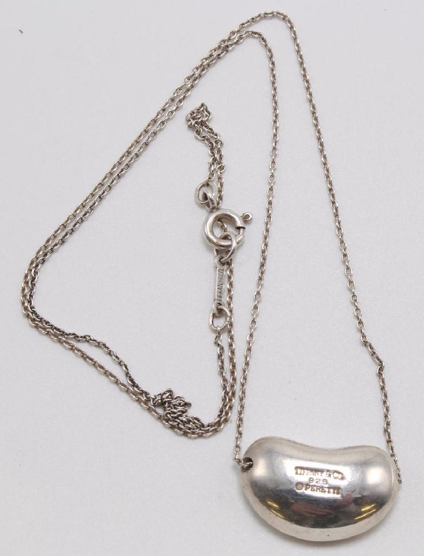 NECKLACES. TIFFANY & CO. STERLING SILVER. ELSA PERETTI: FEATURES (1) 17" LONG ELSA PERETTI BEAN NECKLACE PLUS (1) 18" LONG FINE LINK CHAIN. COME WITH POUCH AND BOX. 9.1GTW.