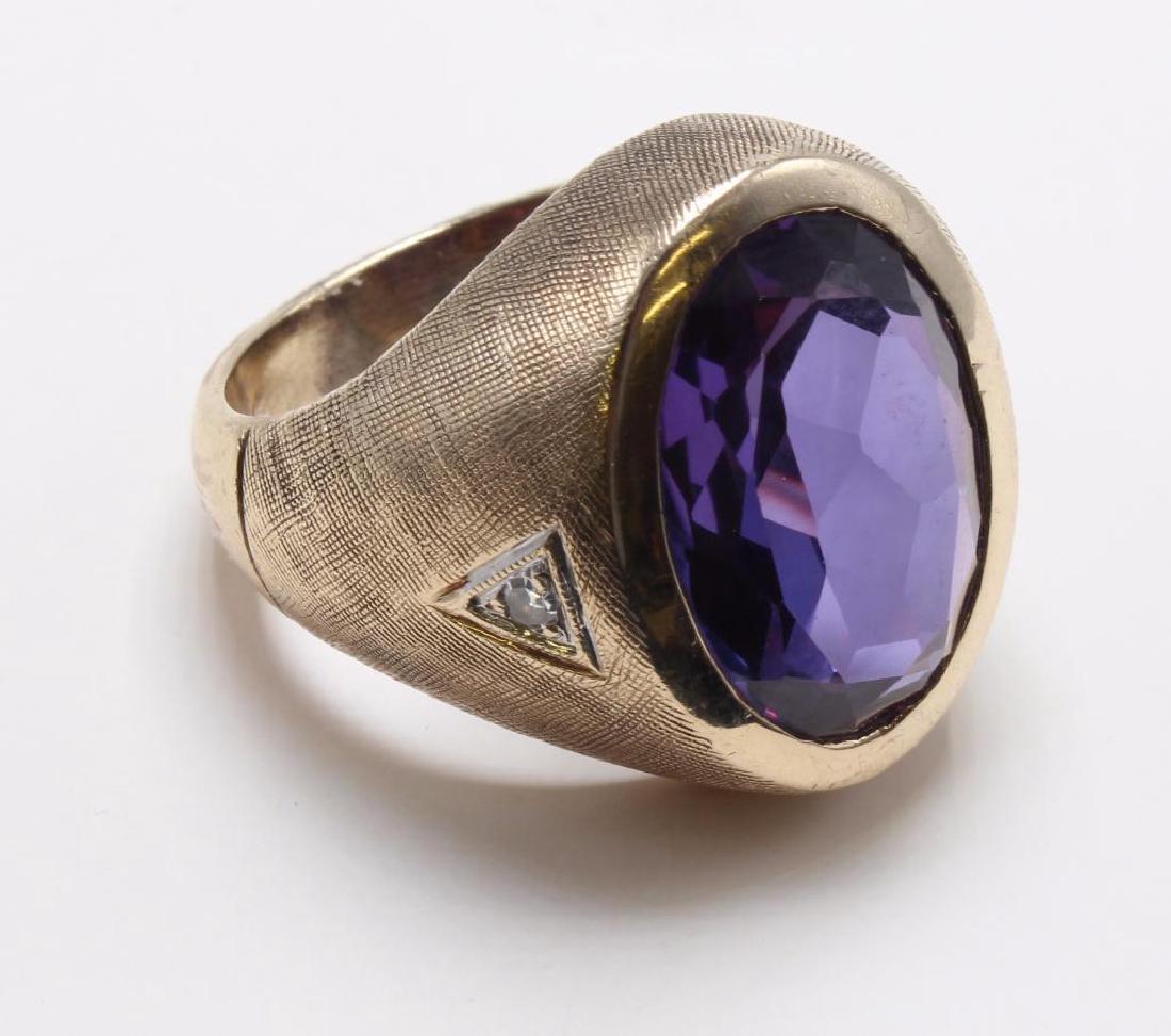 RING. SYNTHETIC ALEXANDRITE, DIAMOND. 14K YELLOW GOLD: FEATURES (1) 17 X 12MM OVAL WITH (2) ROUND ACCENT DIAMONDS. SIZE 8. 12.9GTW.