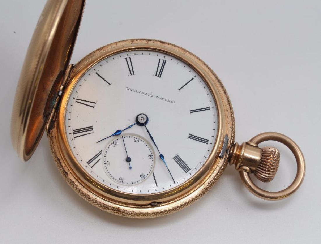 POCKET WATCH. ELGIN NAT'L WATCH CO.: 55MM. HUNTER STYLE. GOLD FILLED. SINGLE SUNK. SERIAL #1716458. MISSING CRYSTAL.