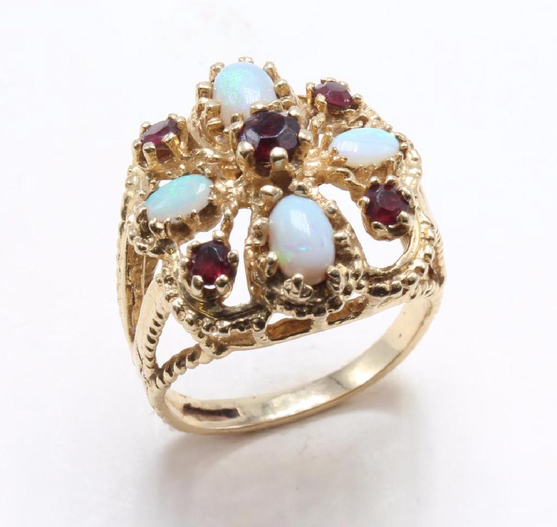 RING. OPAL AND GARNET. 14K YELLOW GOLD: TOP IS 19.5MM. SIZE 8 1/2. 8.5GTW.