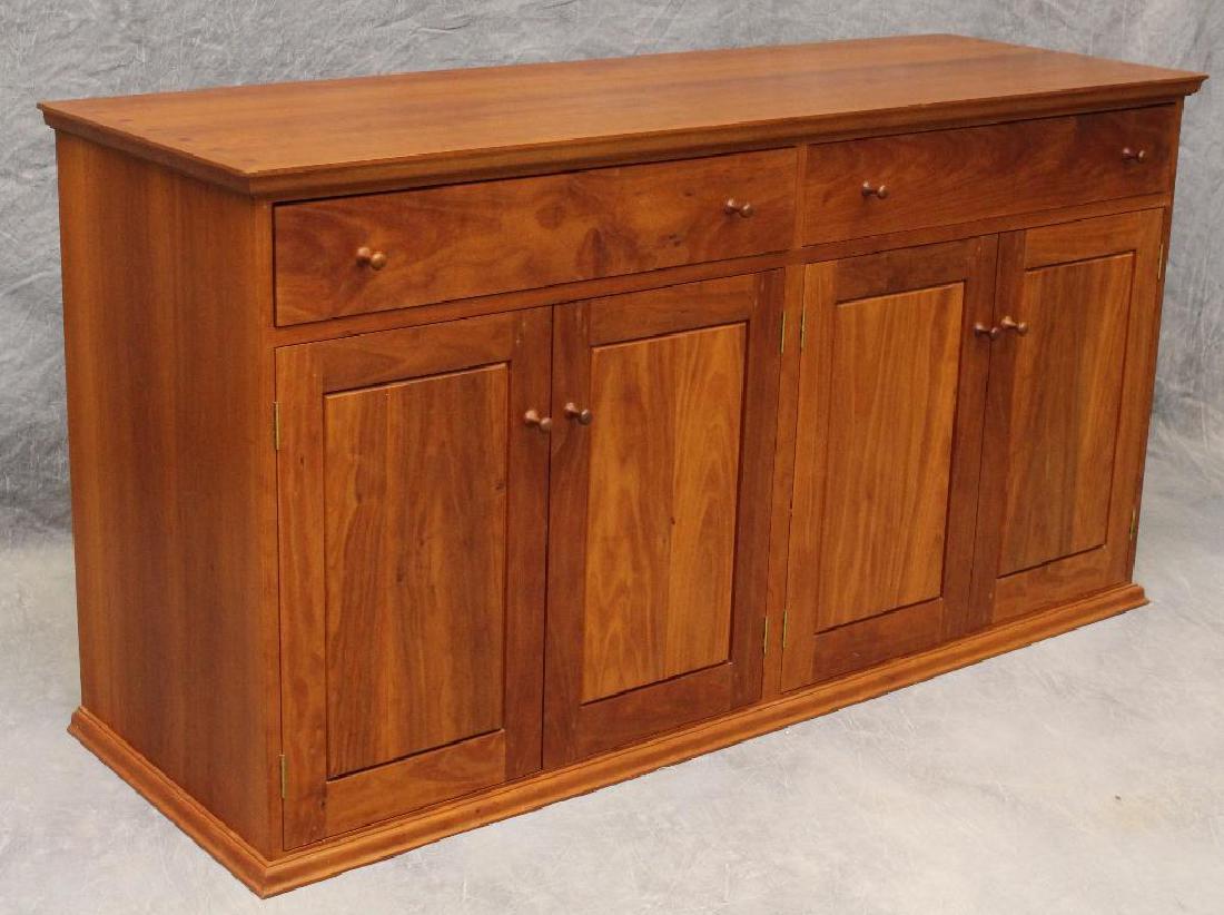 Attributed to Thomas Moser Cherrywood Sideboard: Dovetail top with two drawers over four doors, 31.5"h x 60"w x 20"d.