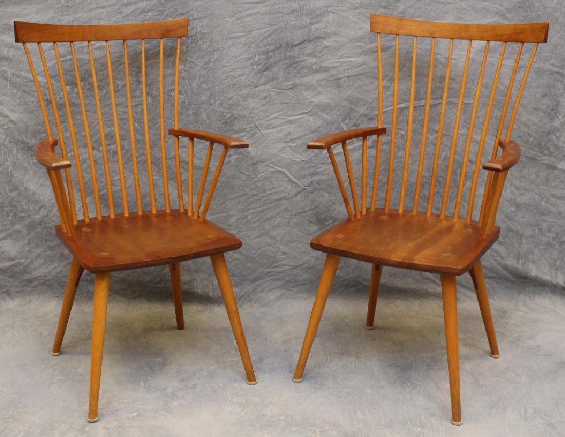 Pair of Thomas Moser Custom Made Armchairs: Cherry with spindle backs, saddle seats on spade legs. Signed on underside with personal dedication. 41.5"h x 23"w x 18"d.