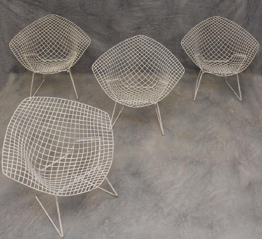 Set of (4) Harry Bertoia Diamond Chairs: White painted, 30"h x 33.5"w x 18"d. Oxidation is present around the legs and underneath.