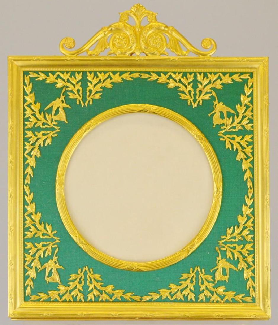 French Empire Neoclassical Ormolu Frame: Figural ormolu decoration on a green background. 8.5"h x 6.75"w