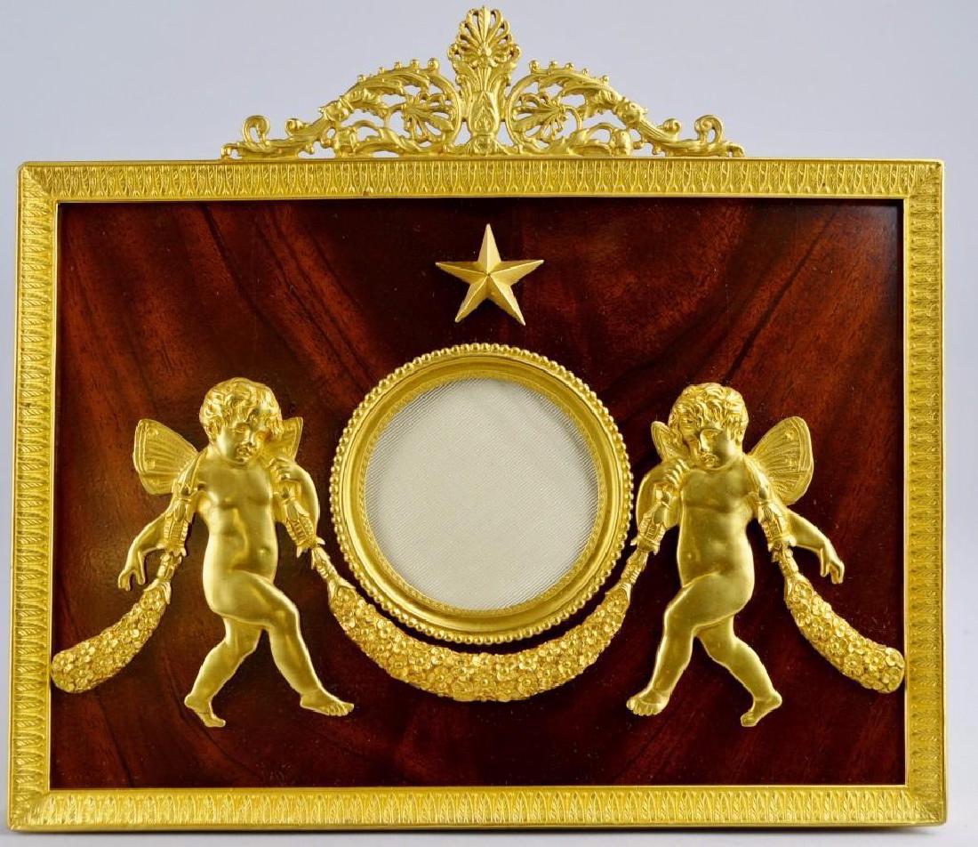 French Empire Neoclassical Moire Ormolu Frame: Large central putti decoration and finely detailed borders, with solid mahogany insert. 10"h x 9"w