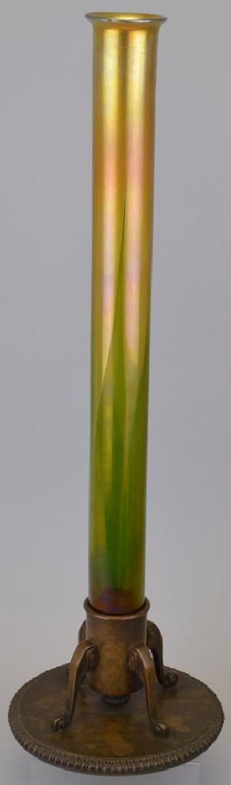 Tiffany Favrille Glass and Bronze Vase: Signed "L.C.T", base marked Tiffany Studios 715. Small flea bite on rim. 25.5"h x 7.5"w height incudes base. 