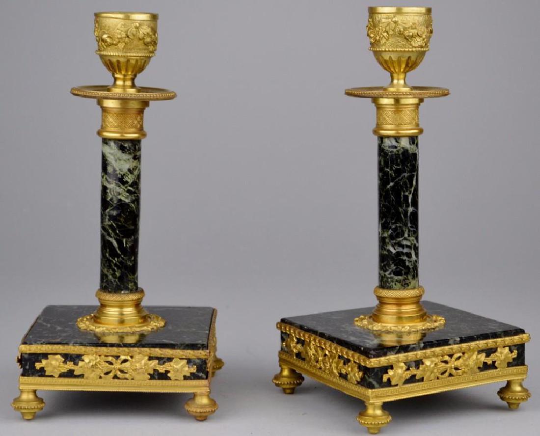 Regency Ormolu and Marble Candlesticks: Ormolu decoration and dark green marble construction. 7"h x 3.25"w x 3.25"d