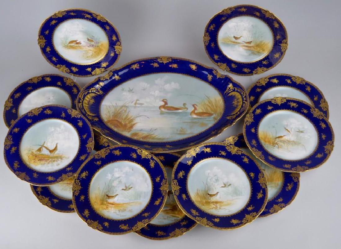 Theodore Haviland Cobalt Blue French Limoges: Serving dish and plates with various species of birds. All signed "J. Martin". 18.5"h x 12.5"w and (12) 9"diameter