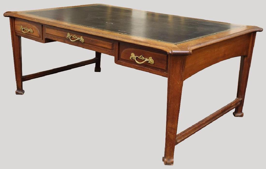 Art Nouveau Partner's Desk: Mahogany with three frieze drawers on each side and a leather inset top on tapered molded legs. 30"h x 74"w x 49-1/2"d
