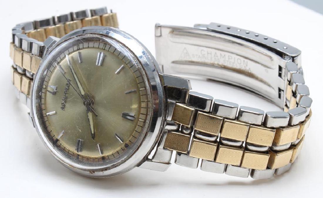 WRIST WATCH. ACCUTRON. BULOVA. STAINLESS STEEL: 34.9MM DIAMETER. WATERPROOF. DEPLOYMENT BAND NEEDS REPAIR OR PUT BACK TOGETHER AT PIN.