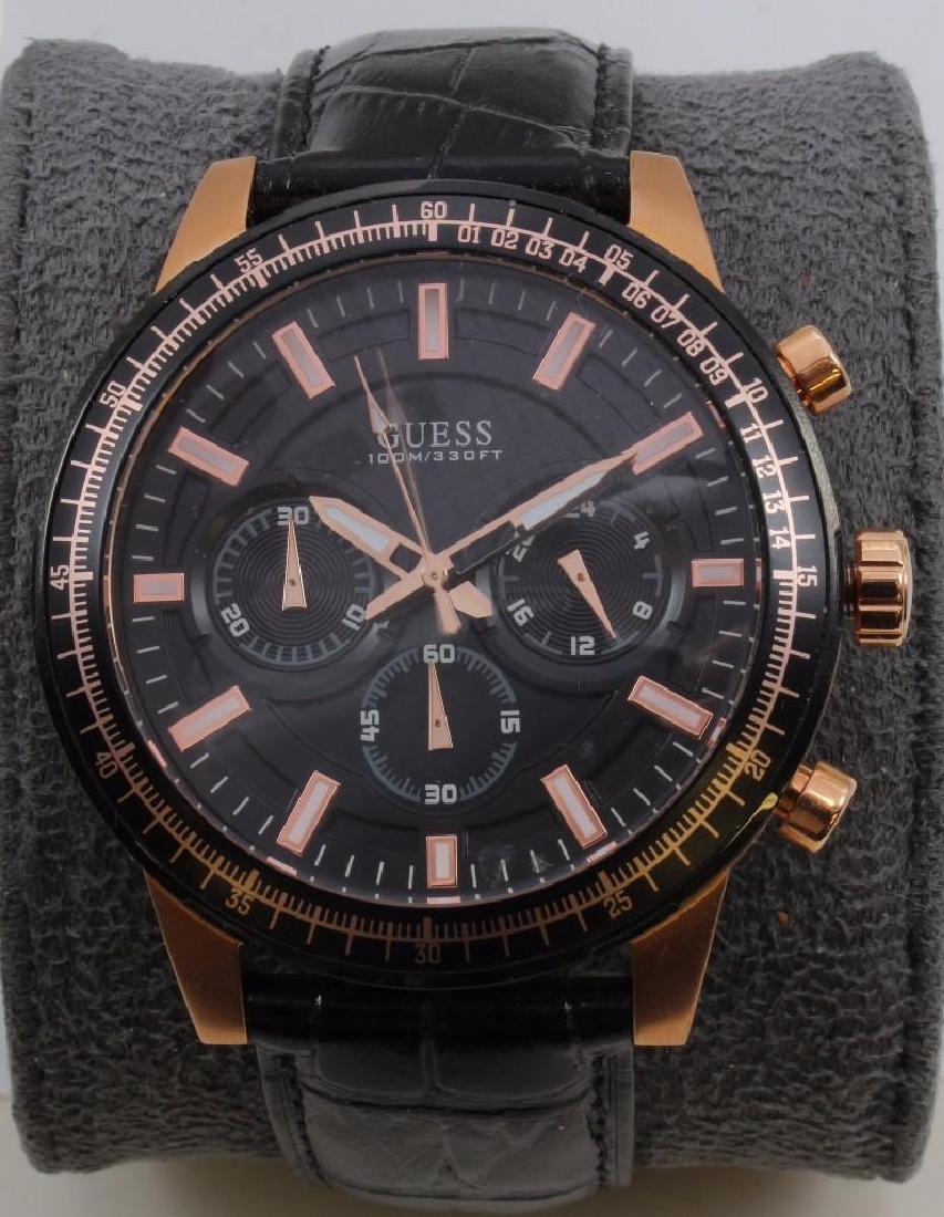 GUESS CHRONOGRAPH WRIST WATCH: 52.3MM LUG END TO LUG END. BLACK LEATHER BAND.