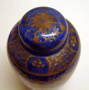 Chinese Porcelain Blue Gilt Covered Urn Vase: 19th C., with hand-painted gold flowers, foliage, bats, and patterned borders on a blue ground. Original domed porcelain lid. Some light wear to gold and some areas of surface dirt, which can be