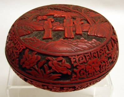 Chinese Carved Two-tone Cinnabar Lacquer Box: 18th/19th C., circular form of red with black background. Finely carved scene of figures in garden landscape on domed lid top, wide floral band on sides. Light wear small losses to background