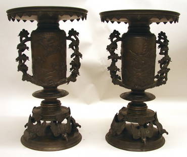 Pair Large Japanese Bronze Vases of Meiji Period: 19th C., each formed in two pieces with elaborate details like wide flared opening with flower design, pine tree branch handles, figural and crane landscape scenes, and five mythical bird beast feet